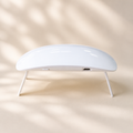 Hiconic mini LED nail lamp, front view, folding legs open