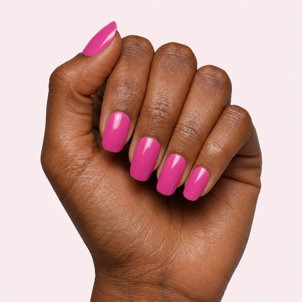 Fuchsia pink gel nail strips worn on a deep skin tone hand