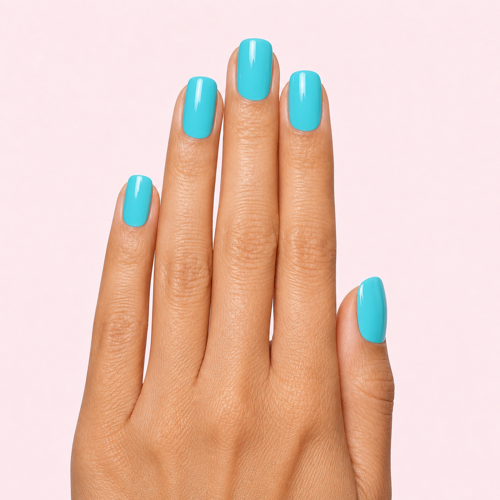 Turquoise aqua blue gel nail strips worn on a tan olive skin tone hand